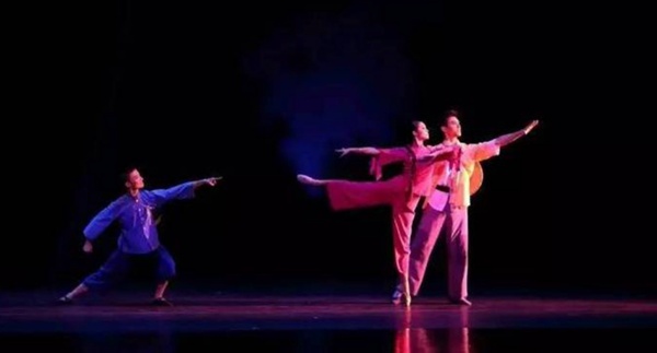 Stage side lighting setup, enhancing depth and highlighting performers during a theatrical dance